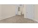 Spacious bonus room with neutral carpeting, offering versatile space for various activities at 4120 Village Nw Blvd, Conover, NC 28613