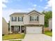 Charming two-story home with stone accents, blue shutters, and a well-manicured front lawn at 4120 Village Nw Blvd, Conover, NC 28613