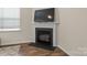 Close-up of fireplace with mantle and hearth at 4120 Village Nw Blvd, Conover, NC 28613