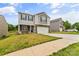 Two-story home with stone accents and a two-car garage at 4120 Village Nw Blvd, Conover, NC 28613