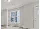 Spacious living area with a large window and gray vinyl plank flooring at 2122 Acclaim St, Charlotte, NC 28205