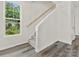 Modern staircase with a light wood handrail and gray carpeting at 2122 Acclaim St, Charlotte, NC 28205