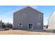 A flat backyard features a patio door and grassy area, providing a canvas for outdoor living and entertainment at 3655 Mercer St, Terrell, NC 28682