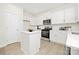 Stylish kitchen showcasing white cabinets, stainless steel appliances, and ample counter space at 3655 Mercer St, Terrell, NC 28682