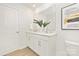 Modern bathroom featuring a double vanity with sleek white countertops and stylish fixtures and adjacent toilet at 3663 Mercer St, Terrell, NC 28682