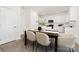 Bright dining area with a modern table, comfortable chairs, and views into the kitchen at 3663 Mercer St, Terrell, NC 28682