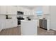 Modern kitchen with white cabinets, stainless steel appliances, an island, and ample counter space at 3663 Mercer St, Terrell, NC 28682