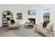 Comfortable sitting area featuring neutral armchairs, a fireplace, and ample natural light at 3663 Mercer St, Terrell, NC 28682