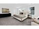 Bright main bedroom with a large bed, neutral décor, and ample natural light from two windows at 3663 Mercer St, Terrell, NC 28682
