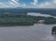 Panoramic lake view with distant mountain range at 4409 Solemn Point Ln, Charlotte, NC 28216