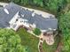 Aerial view showcasing home, patio, and backyard landscaping at 4409 Solemn Point Ln, Charlotte, NC 28216