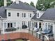 Elevated backyard patio with pergola, seating, and grill at 4409 Solemn Point Ln, Charlotte, NC 28216