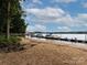 Sandy lakeshore with a private boat dock and calm water at 4409 Solemn Point Ln, Charlotte, NC 28216