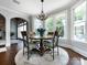 Bright dining area with round table and four chairs near sunroom at 4409 Solemn Point Ln, Charlotte, NC 28216