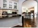 Kitchen boasts granite counters, white cabinets, and a breakfast bar at 4409 Solemn Point Ln, Charlotte, NC 28216