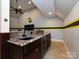 Wet bar with granite countertop and wine cooler at 4409 Solemn Point Ln, Charlotte, NC 28216