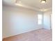 Well-lit bedroom with a tray ceiling, recessed lights, and neutral-colored carpet at 2054 Van Buren Rd, Sherrills Ford, NC 28673