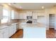 Kitchen featuring granite countertops, white cabinetry, stainless steel appliances, and wood-look flooring at 2054 Van Buren Rd, Sherrills Ford, NC 28673