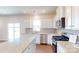 Kitchen featuring granite countertops, stainless steel appliances, white cabinetry, and wood-look flooring at 2054 Van Buren Rd, Sherrills Ford, NC 28673