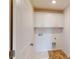 Laundry room includes a utility sink and storage cabinets with a white finish at 2054 Van Buren Rd, Sherrills Ford, NC 28673