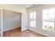 Office space features neutral walls, wood-look floors, and large windows providing lots of natural light at 2054 Van Buren Rd, Sherrills Ford, NC 28673