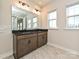 Bathroom with double sink vanity, large mirrors, and tile flooring at 139 Armstrong Rd, Belmont, NC 28012