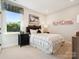 Cozy bedroom with a modern decor, including a stylish bed and a large window at 139 Armstrong Rd, Belmont, NC 28012