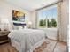 Bright bedroom with a large window, stylish decor, and a comfortable-looking bed with designer rug at 139 Armstrong Rd, Belmont, NC 28012