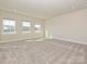 Spacious carpeted bedroom with plenty of natural light from the large windows at 139 Armstrong Rd, Belmont, NC 28012