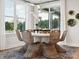 Cozy dining space with stylish chairs surrounding a round table, complemented by natural light streaming through large windows at 139 Armstrong Rd, Belmont, NC 28012