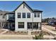 This townhome displays gray siding, black trim, and manicured landscaping, presenting an inviting curb appeal at 139 Armstrong Rd, Belmont, NC 28012