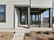 An inviting front porch features a covered entryway, and steps leading to a door with sidelights and the house number at 139 Armstrong Rd, Belmont, NC 28012
