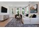 Bright living room featuring a large sectional sofa, area rug, and lots of natural light at 139 Armstrong Rd, Belmont, NC 28012