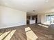 Expansive open-concept living room with wood floors connecting to a kitchen island and offering abundant natural light at 139 Armstrong Rd, Belmont, NC 28012