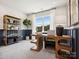 Home office with custom wainscotting, large wood desk, and shelving unit at 139 Armstrong Rd, Belmont, NC 28012
