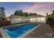 Home with pool and deck; twilight view at 1626 S Wendover Rd, Charlotte, NC 28211