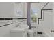 Clean bathroom with black and white tile and updated vanity at 1626 S Wendover Rd, Charlotte, NC 28211