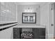 Elegant bathroom features granite vanity, stylish mirror, and black and white tile at 1626 S Wendover Rd, Charlotte, NC 28211