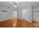 Hardwood floor bedroom with ample closet space and neutral walls at 1626 S Wendover Rd, Charlotte, NC 28211