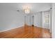 Bright bedroom with hardwood floors, neutral walls, and a large closet at 1626 S Wendover Rd, Charlotte, NC 28211