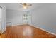 Bright bedroom featuring hardwood floors and neutral walls at 1626 S Wendover Rd, Charlotte, NC 28211