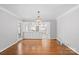 Dining room with hardwood floors and view of kitchen at 1626 S Wendover Rd, Charlotte, NC 28211