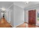 Bright entryway with hardwood floors and a wooden front door at 1626 S Wendover Rd, Charlotte, NC 28211