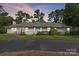 White brick ranch house with a large front yard and long driveway at 1626 S Wendover Rd, Charlotte, NC 28211