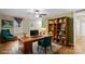 Bright home office with built-in shelving and hardwood floors at 1626 S Wendover Rd, Charlotte, NC 28211