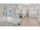 Bright kitchen features white cabinets, marble countertops, and stainless steel appliances at 1626 S Wendover Rd, Charlotte, NC 28211