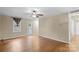 Spacious living room with hardwood floors and a ceiling fan at 1626 S Wendover Rd, Charlotte, NC 28211
