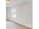 Bright bedroom with carpeted floors and a large window at 2070 Van Buren Rd, Sherrills Ford, NC 28673