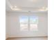 Well-lit bedroom with two large windows and carpet flooring at 2070 Van Buren Rd, Sherrills Ford, NC 28673