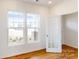 Home office with hardwood floors, built-in shelving and large windows at 2070 Van Buren Rd, Sherrills Ford, NC 28673